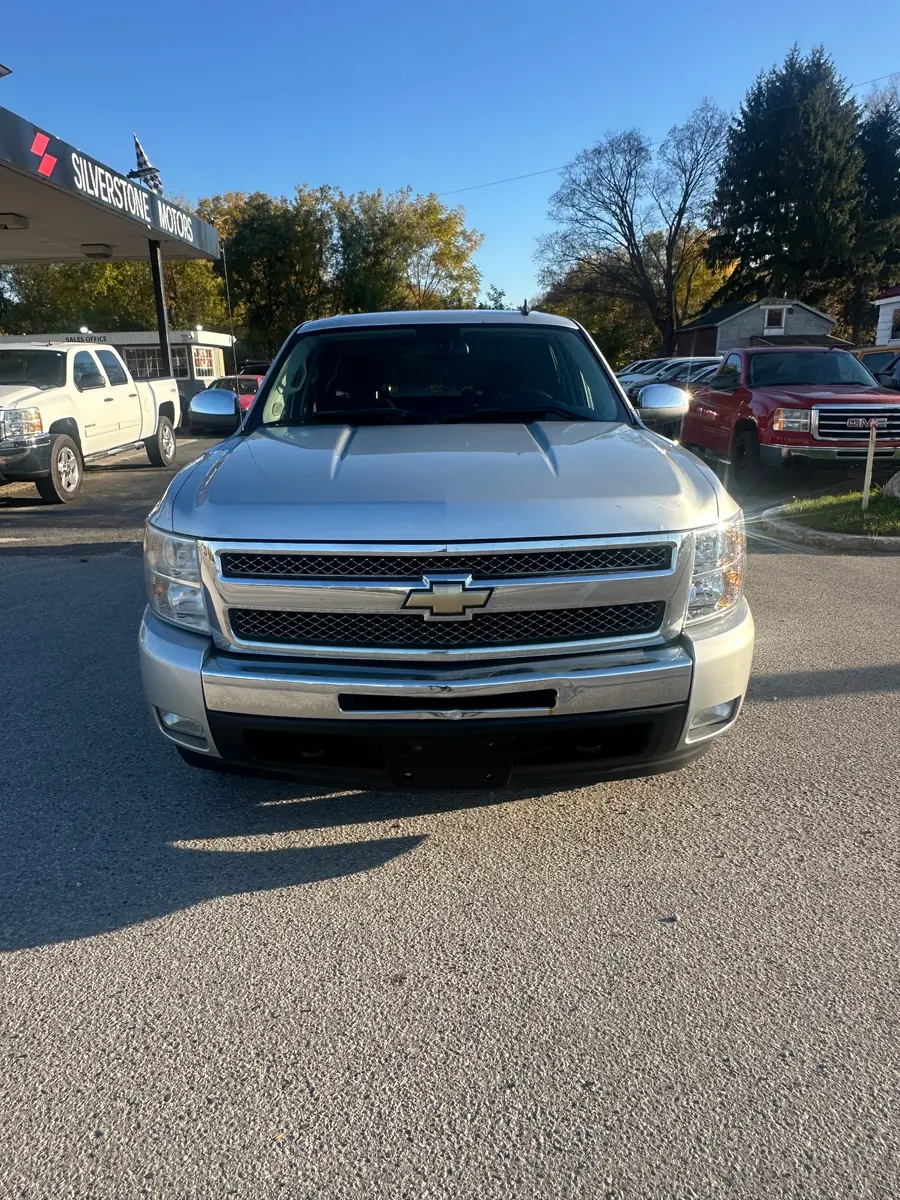 2011 Chevrolet Silverado LT Z71 CREW CAB SHORT BOX Silver front exterior view at dealership lot with chrome grille and headlights.